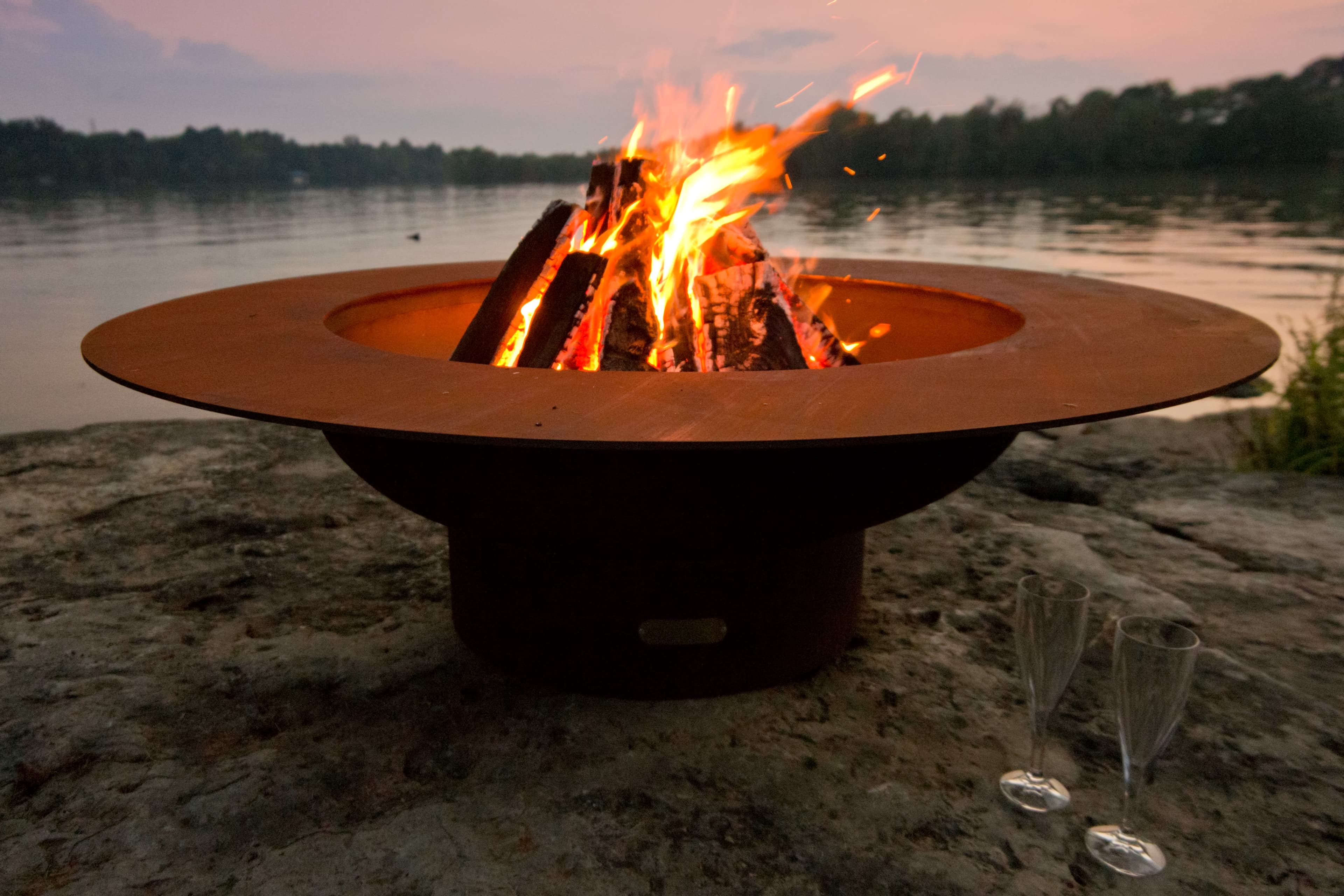 One Fire Pit at the Edge of a Lake at Sunset